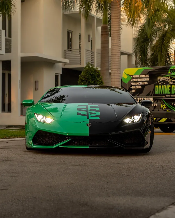 Green and black Lamborghini Huracan parked in front of the Divine Detailers van