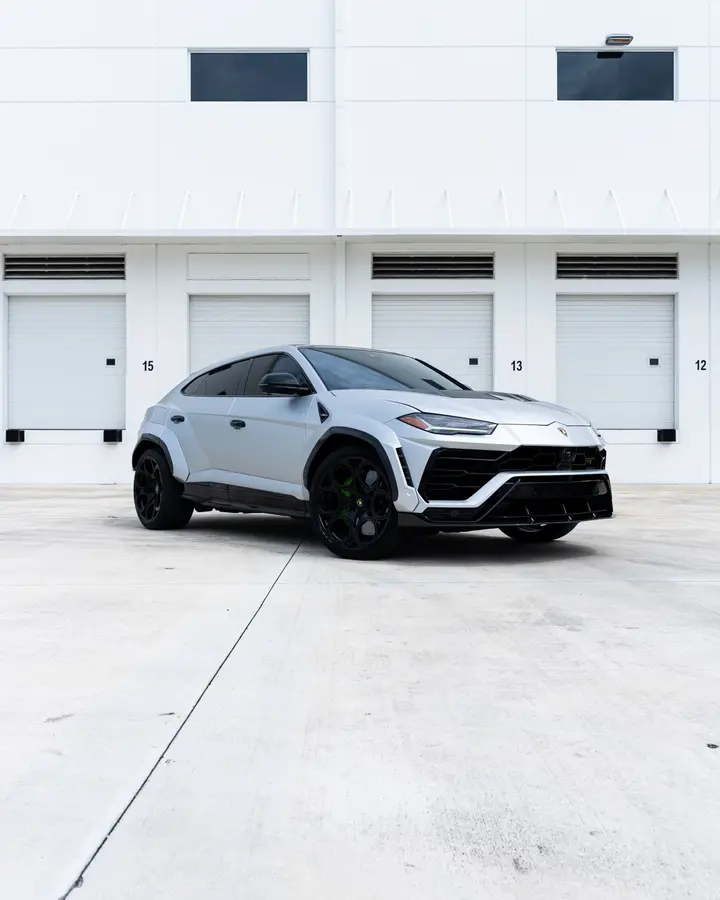 Matte silver Lamborghini Urus with carbon fiber body kit and black wheels
