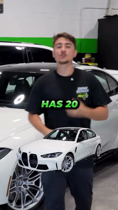 Divine Detailers explaining paint protection film on a white BMW M3