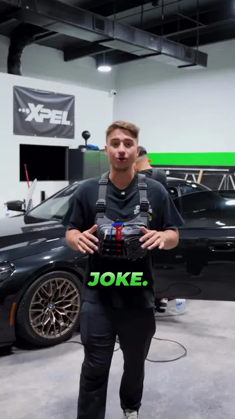 Divine Detailers explaining paint protection film and window tint on a BMW M2 CS