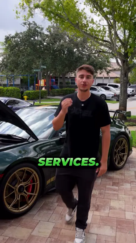 Divine Detailers explaining mobile detailing on a Porsche 911