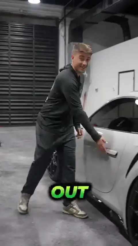 Divine Detailers explaining paint protection film and coatings on a gray Porsche 911 Turbo