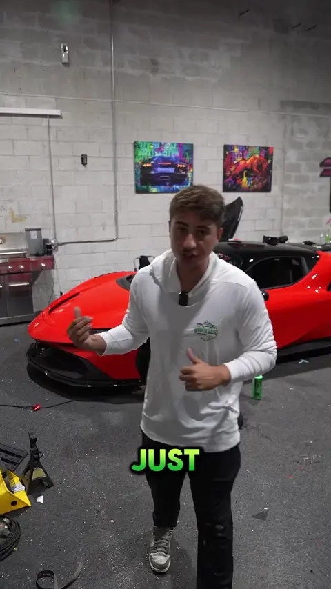Divine Detailers explaining paint correction on a red Ferrari SF90